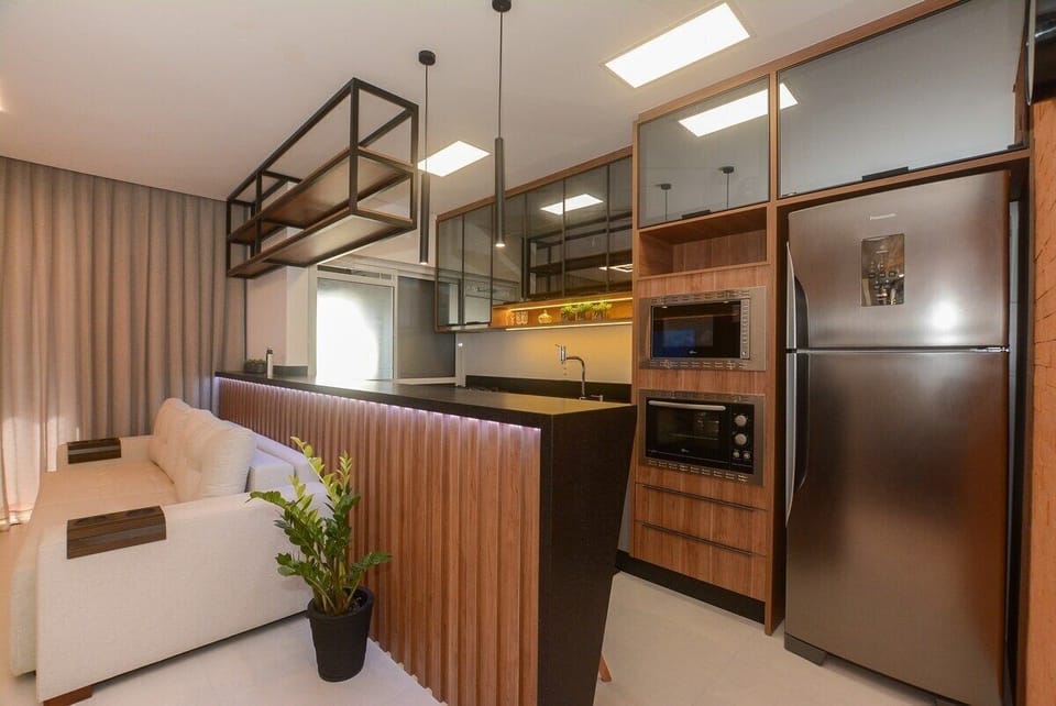 Deluxe Apartment, Pool Access | Private kitchen | Fridge, microwave, cookware/dishes/utensils, dining tables