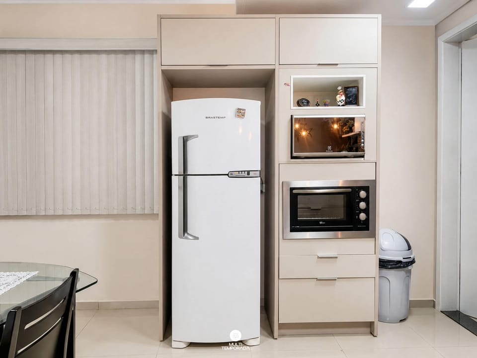 Family House | Private kitchen | Fridge, microwave, cookware/dishes/utensils, dining table