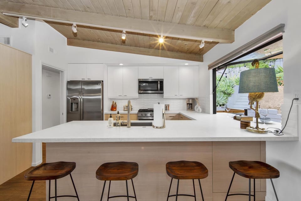 Kitchen with bar stool seating.