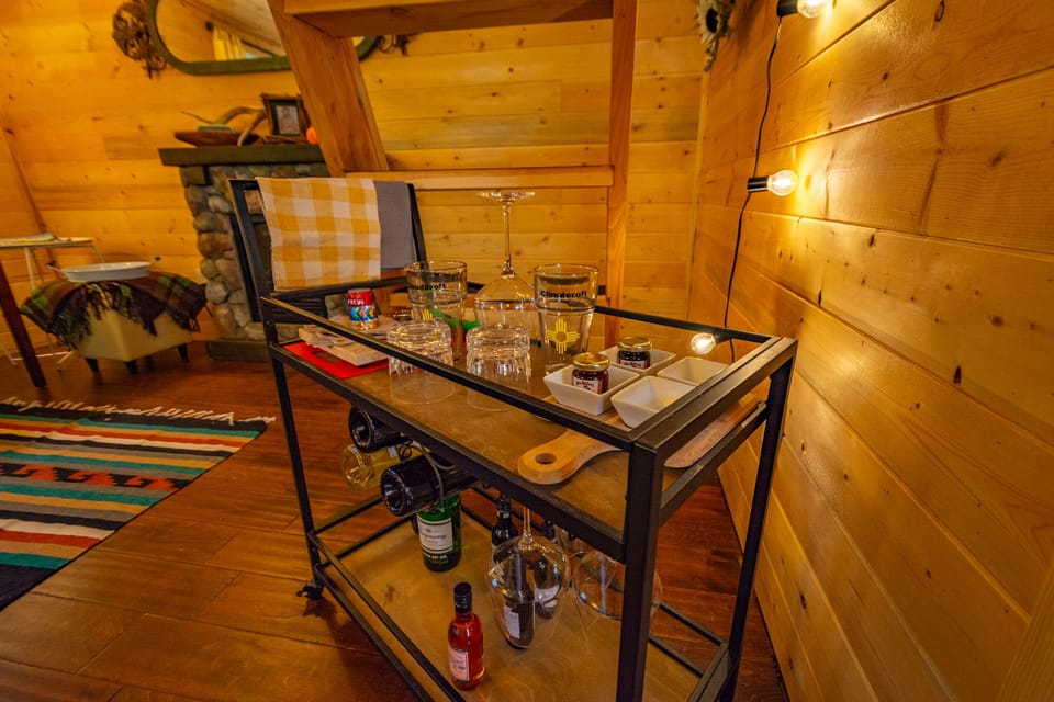 Bar Cart features beer and wine glasses, tools, appetizer trays for your party. 