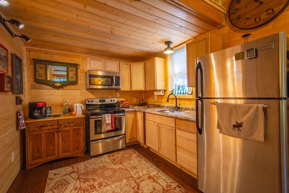 Full Size Stainless Steel Appliances, electric range, microwave, refrigerator