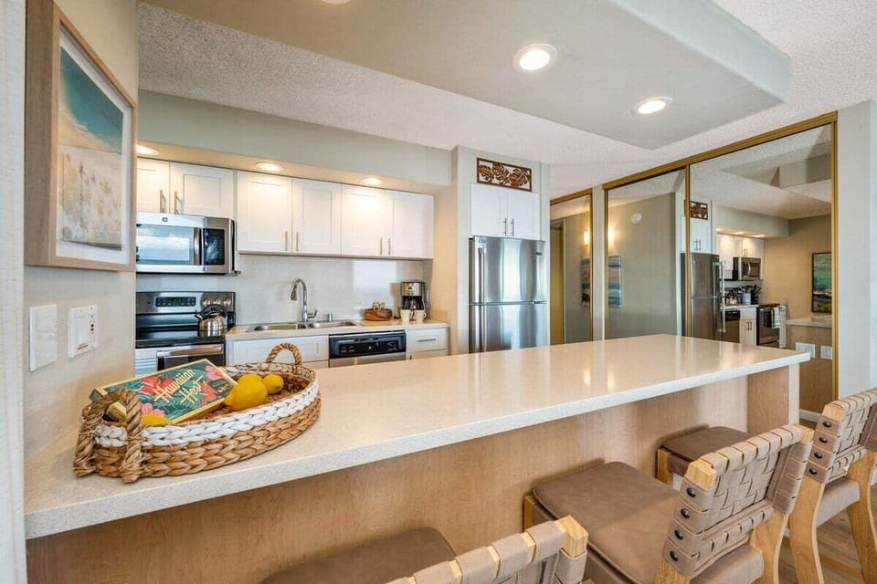 A roomy breakfast bar with stylish seating—ideal for casual meals, morning coffee, or gathering while cooking.
