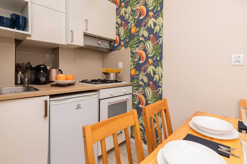 Another view of the dining and kitchen area, highlighting the smart use of space and inviting decor.



