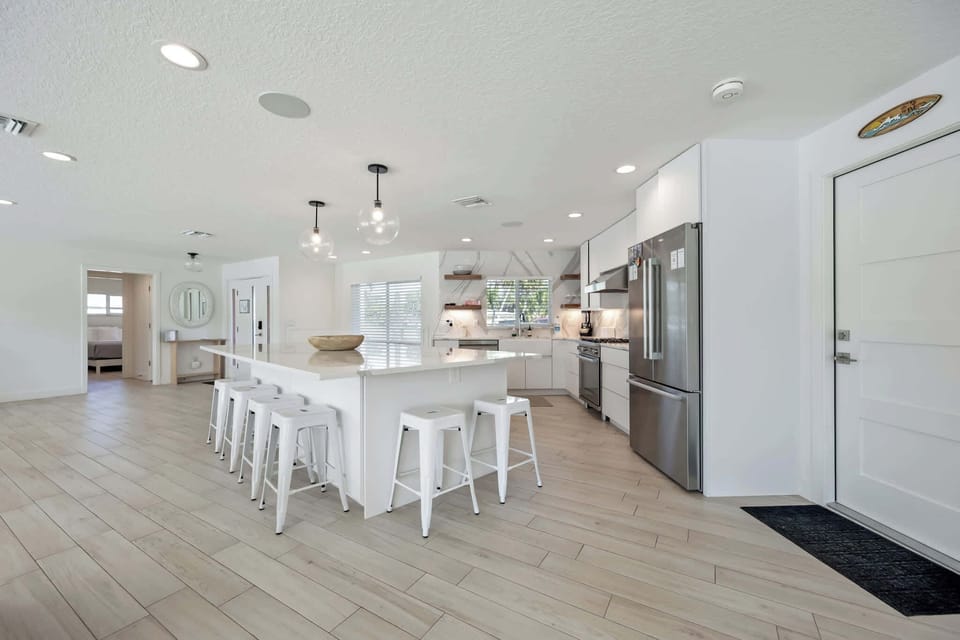 Modern kitchen with a large island and seating for six.