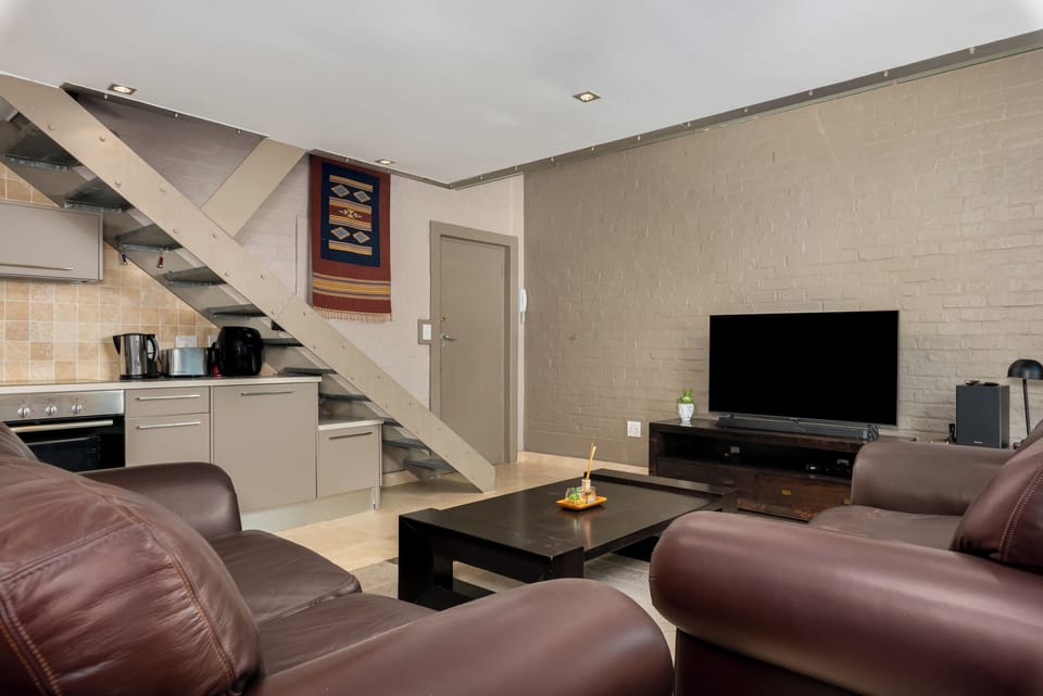 Exclusive Apartment | Living area | 50-inch flat-screen TV with cable channels, Netflix, streaming services