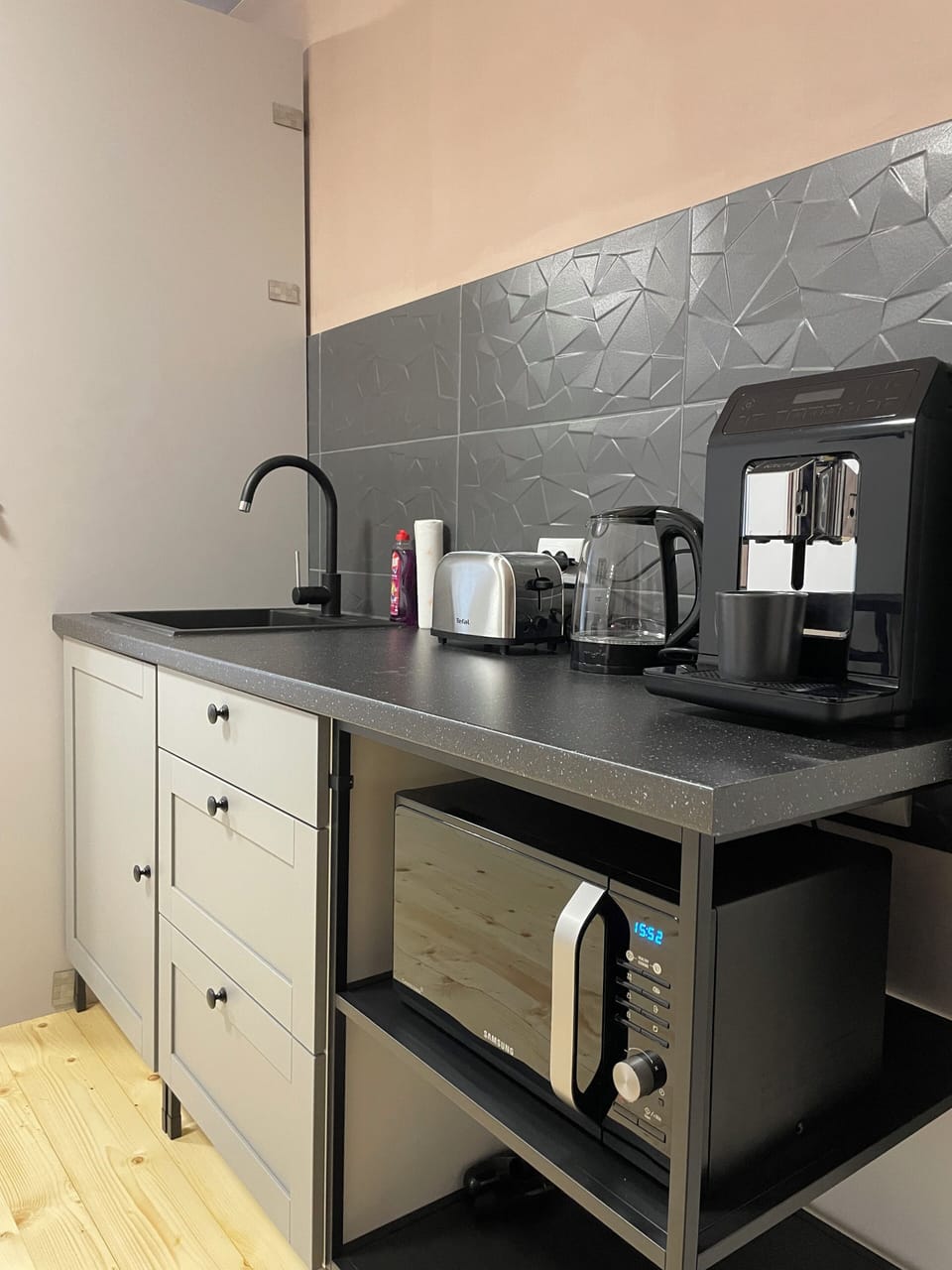 Common area kitchen with a coffee machine, microwave and toaster