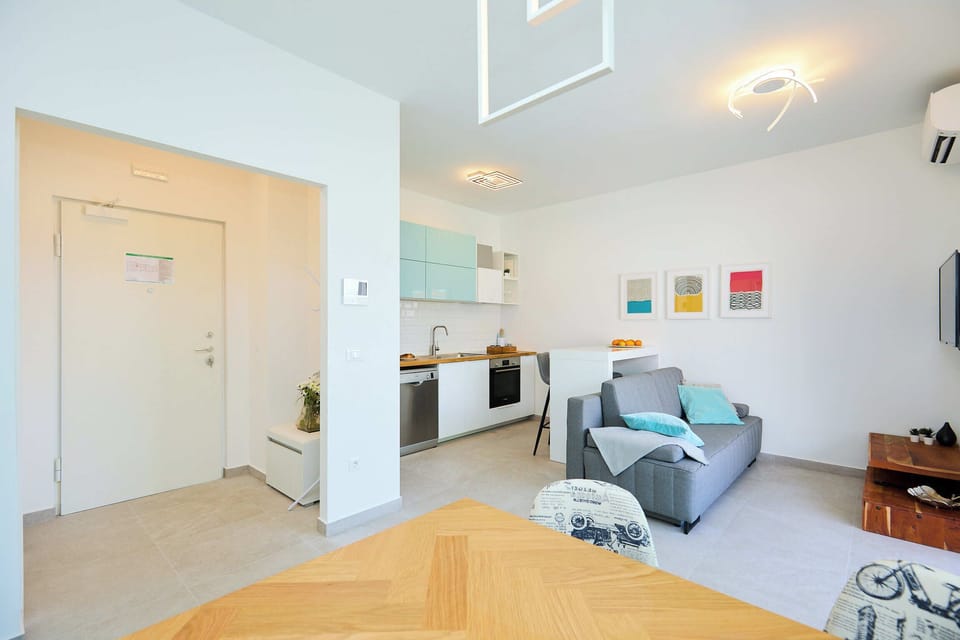 Apartment (1 Bedroom) | Living area | 120-cm Smart TV with cable channels