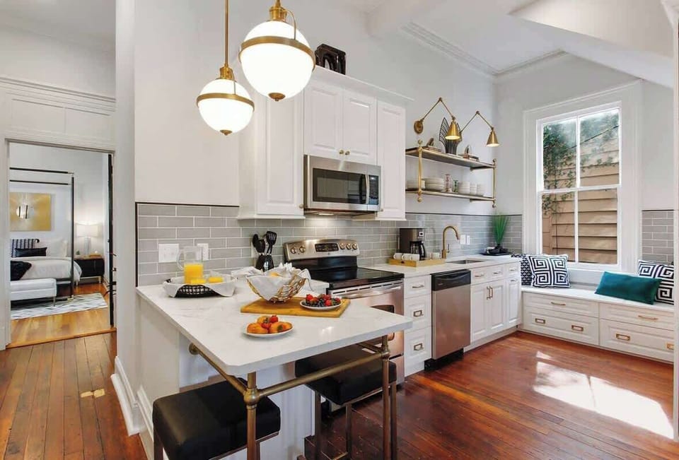Kitchen | Fully Stocked Kitchen with Natural Light | First Floor of Building — Unit on One Level