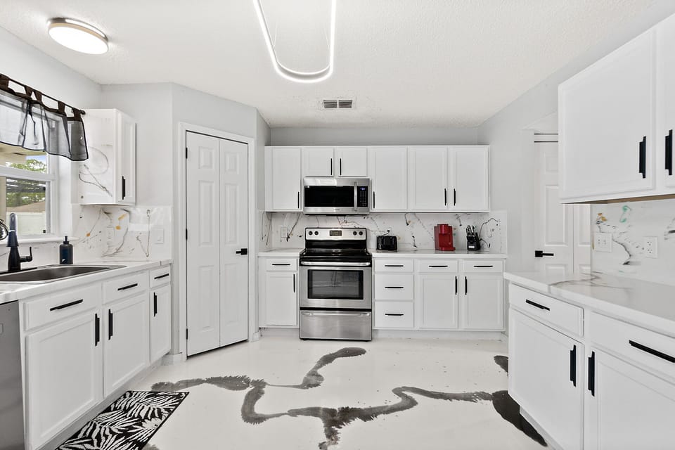 Enjoy cooking in a well-lit, updated kitchen that's equipped with stainless steel appliances