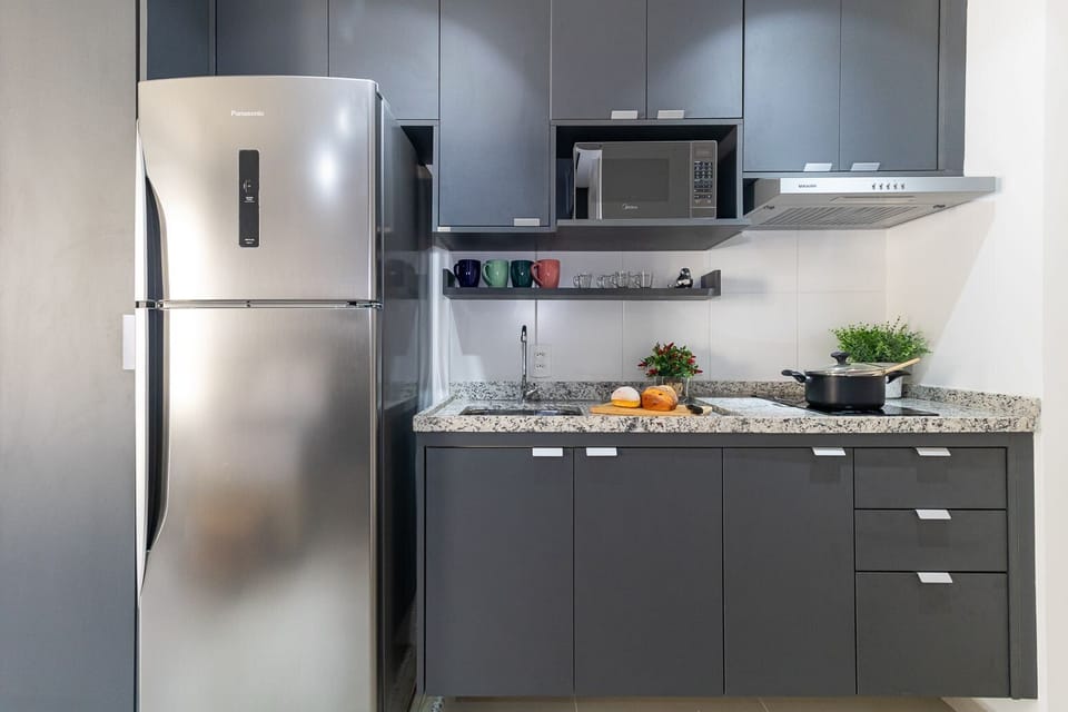 Apartment | Private kitchen | Fridge, microwave, cookware/dishes/utensils, cleaning supplies