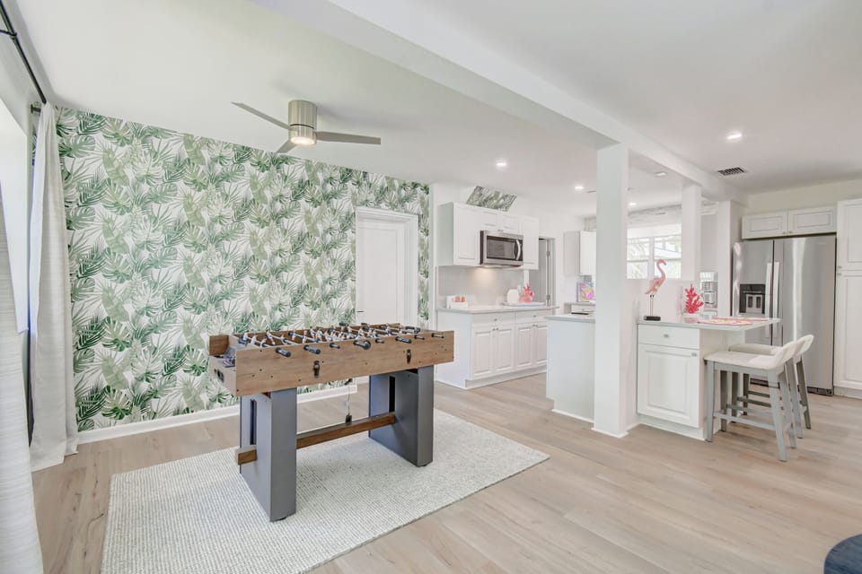Ready for fun: Our game area with a foosball table offers a lively spot for friendly competition and entertainment, making every moment of your Delray Beach stay memorable.