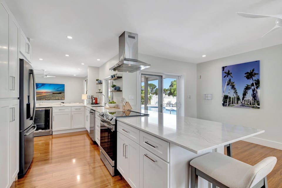 Culinary oasis awaits: Experience the luxury of cooking in Delray Beach with our well-appointed kitchen, featuring ample countertops, state-of-the-art appliances, and a large fridge—all designed for your gourmet adventures.