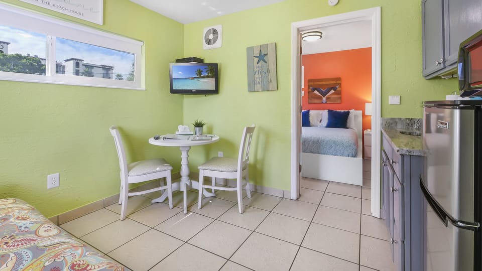 Basic Suite, 1 Bedroom, Kitchenette | Living area | 32-inch flat-screen TV with digital channels, TV, streaming services