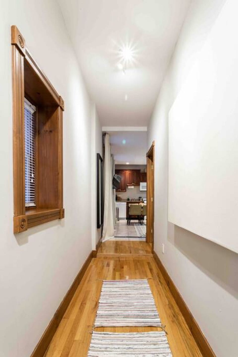 Downtown New Haven Vacation Rental Near Yale – Enjoy a fully equipped kitchen with cookware, coffee essentials, and dining for four, making your stay both convenient and comfortable.