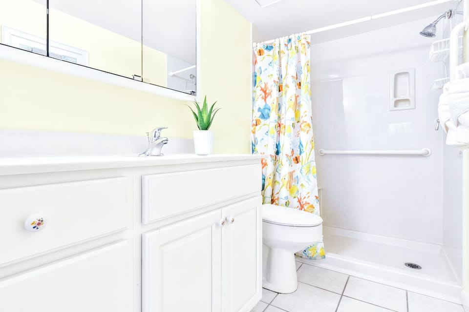 Bright guest bathroom with a step-in shower