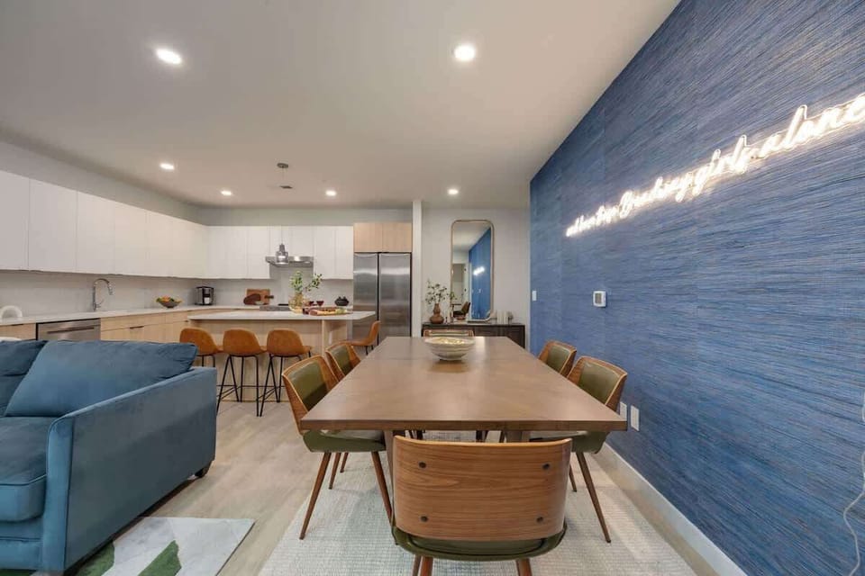 Open-concept floor plan featuring the formal dining area overlooking the fully equipped kitchen.