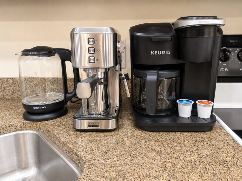 Fully equipped kitchen. Coffee maker is a duo, so it does coffee pot & pods. You can also see in the photo, there is a kettle for tea drinkers.