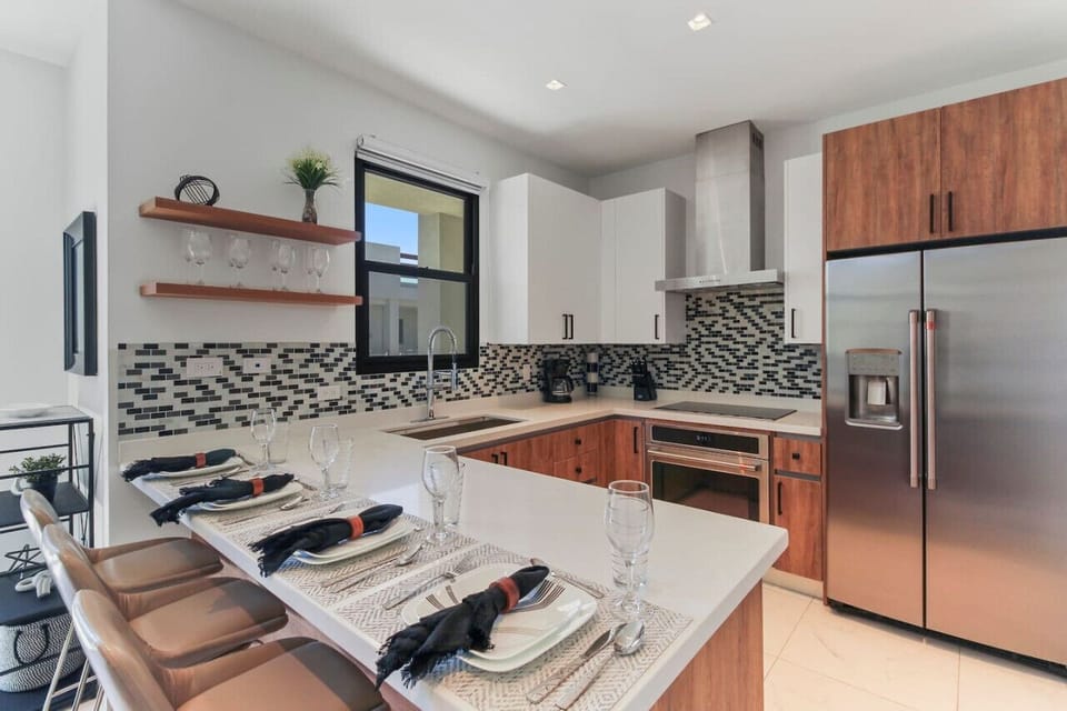 Step into culinary perfection with this sleek and modern kitchen. A chef`s dream, where style meets functionality, making every meal a masterpiece.