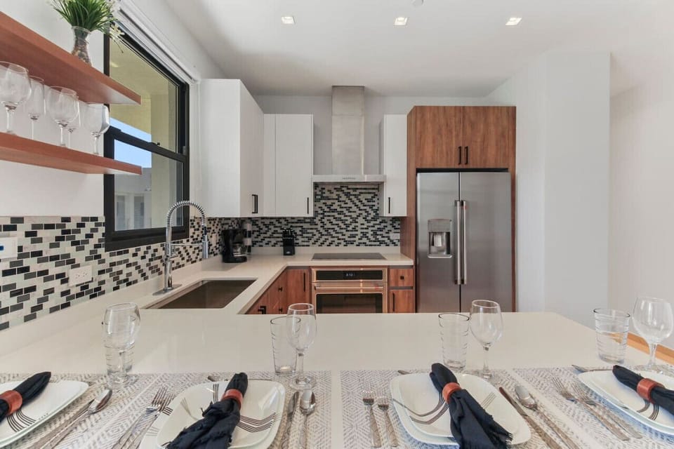 Step into culinary perfection with this sleek and modern kitchen. A chef`s dream, where style meets functionality, making every meal a masterpiece.
