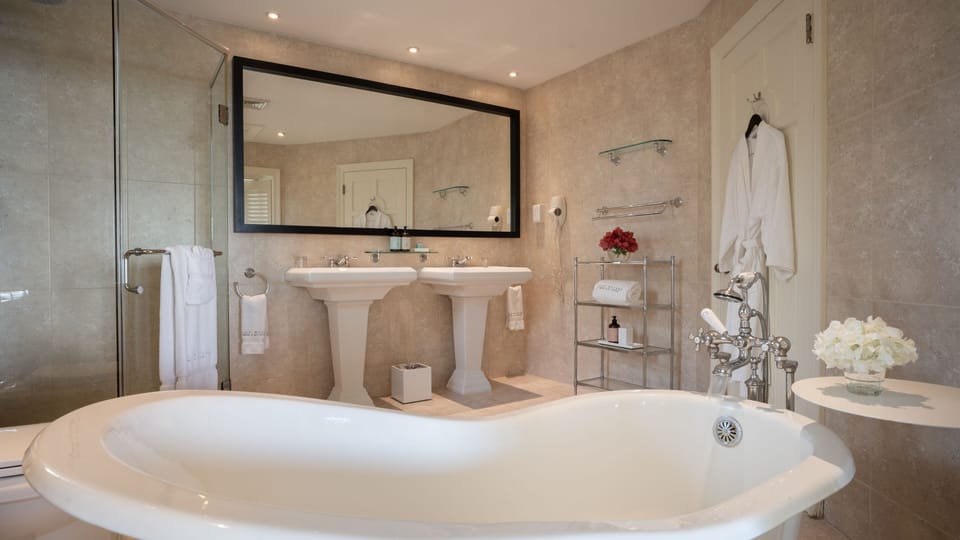 Cove Suite | Bathroom | Separate tub and shower, designer toiletries, hair dryer, bathrobes