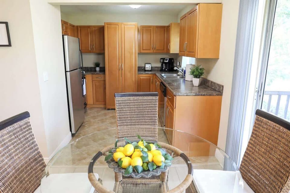 Dining room and kitchen area in Sunnyside Palms vacation rental located in the Fountains of Largo.