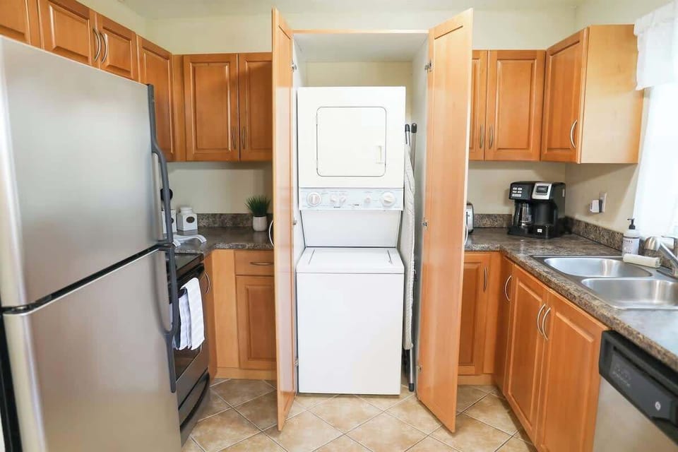 Sunnyside Palms vacation rental's private washer and dryer with laundry detergent and cleaning products for your convenience. 