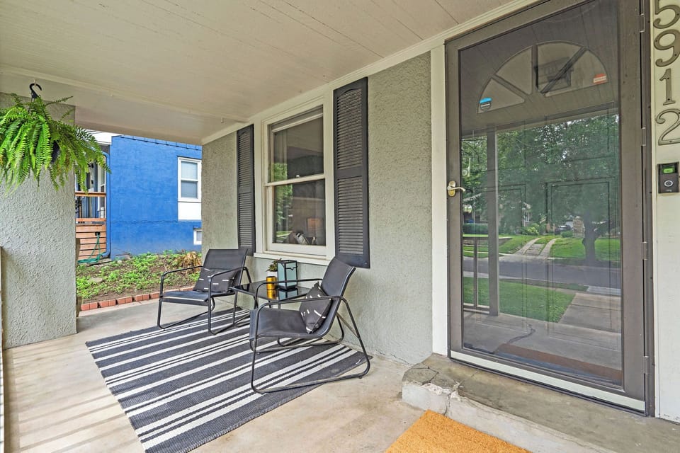 Cozy front porch lounge with comfortable seating, offering a peaceful spot to unwind and enjoy the neighborhood charm Brookside is known for.