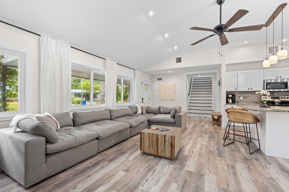 Relax in the spacious living room with a large Modani sectional, perfect for lounging with family and friends.
