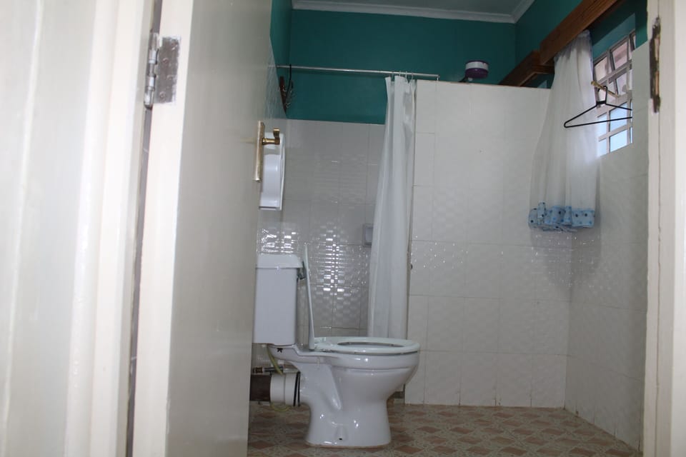Standard Room | Bathroom | Rainfall showerhead, slippers, towels