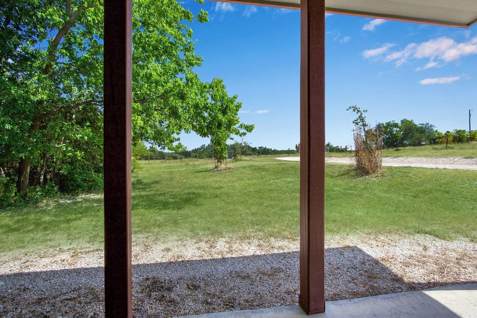 View looking out from the doorway onto the porch.