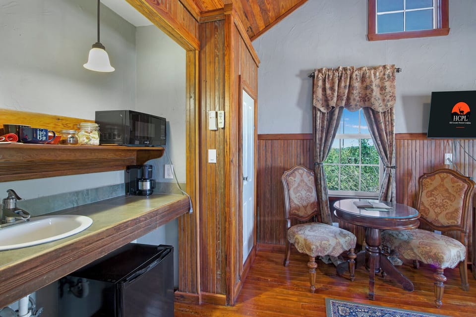 The cottage has a small coffee bar with microwave, refrigerator, and coffee pot.
