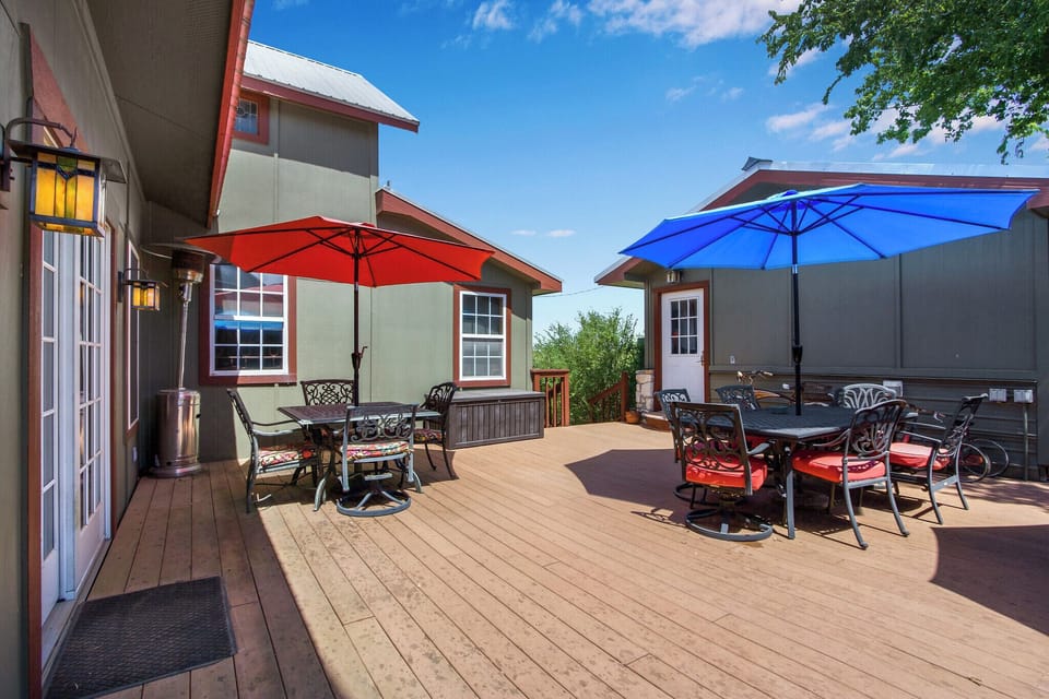 The property has a large shared deck area with lots of tables and seating.