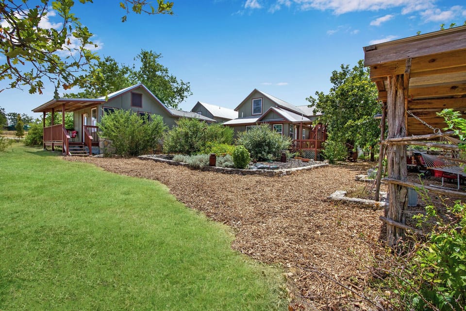 Walk away from the front of the property showing the curve in the path that leads to Rockin Boots.