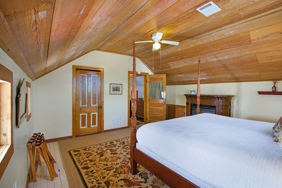 Alternate view in the bedroom showing the entry door and electric fire place.