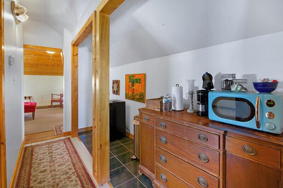 Closer view of the coffee bar looking from the private bedroom down the hall at the other sleeping area.