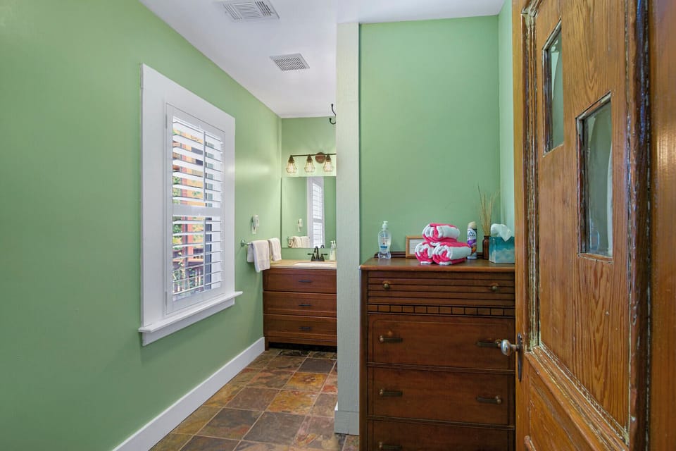 Looking into the bathroom.  This room has a single vanity and shower.
