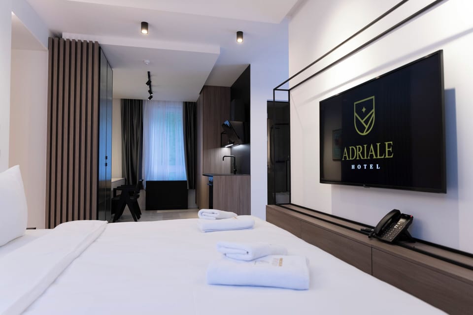 Deluxe Studio | Premium bedding, down comforters, memory foam beds, minibar