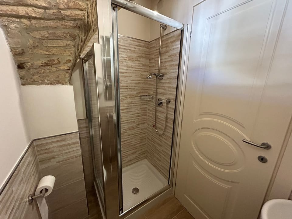 Comfort Room, 1 Double Bed, City View, Ground Floor | Bathroom | Shower, hair dryer, towels