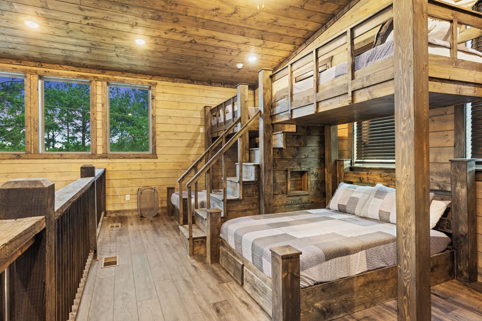 Play, relax, and unwind – the game room loft with cozy bunk beds for all.