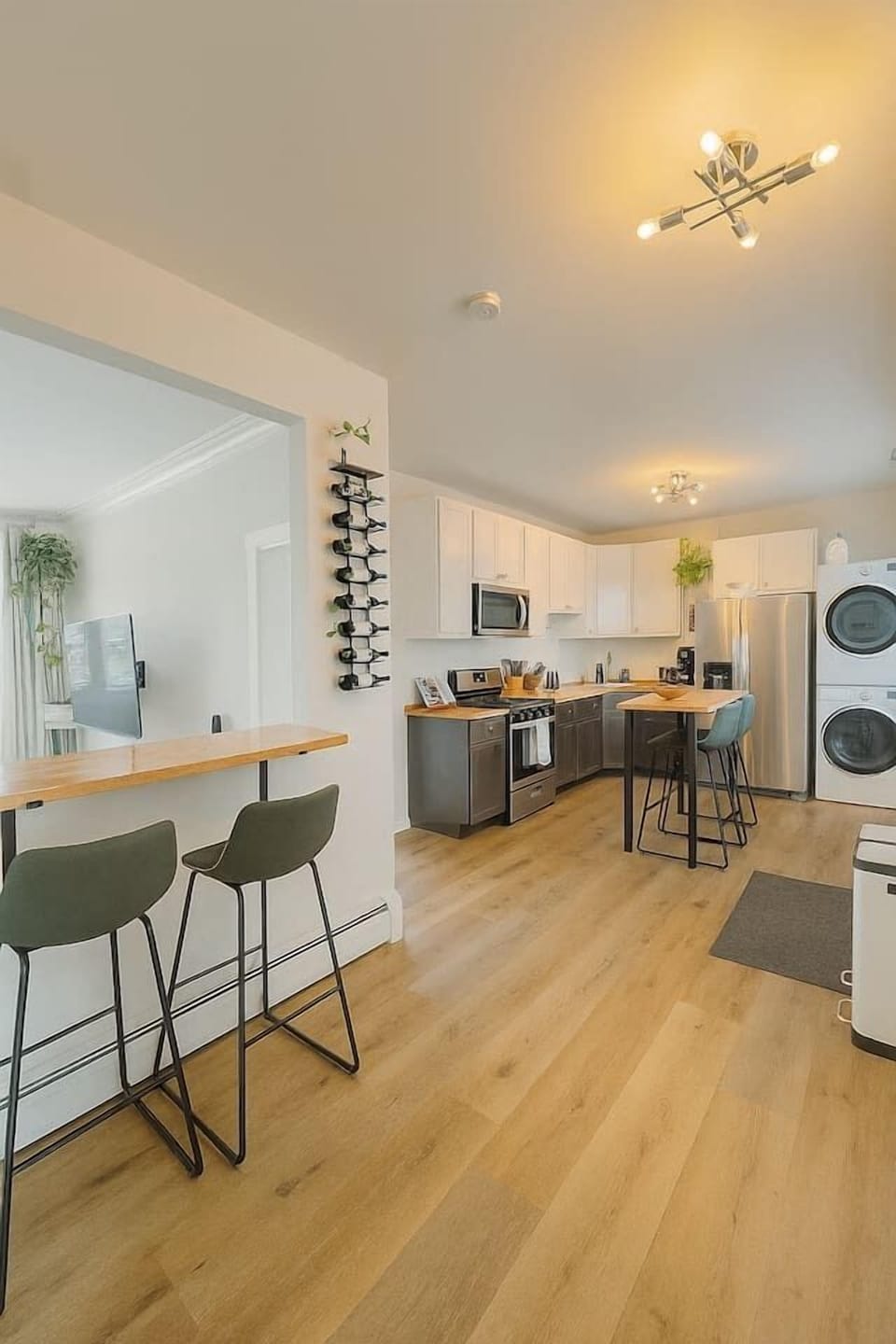 Dining area, fully equipped kitchen, and washer and dryer in unit.