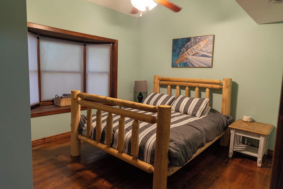 Main level master bedroom with bathroom attached.
