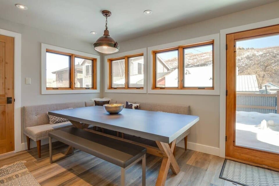 A bright dining nook provides an inviting place for your group to enjoy meals together located right off the kitchen.