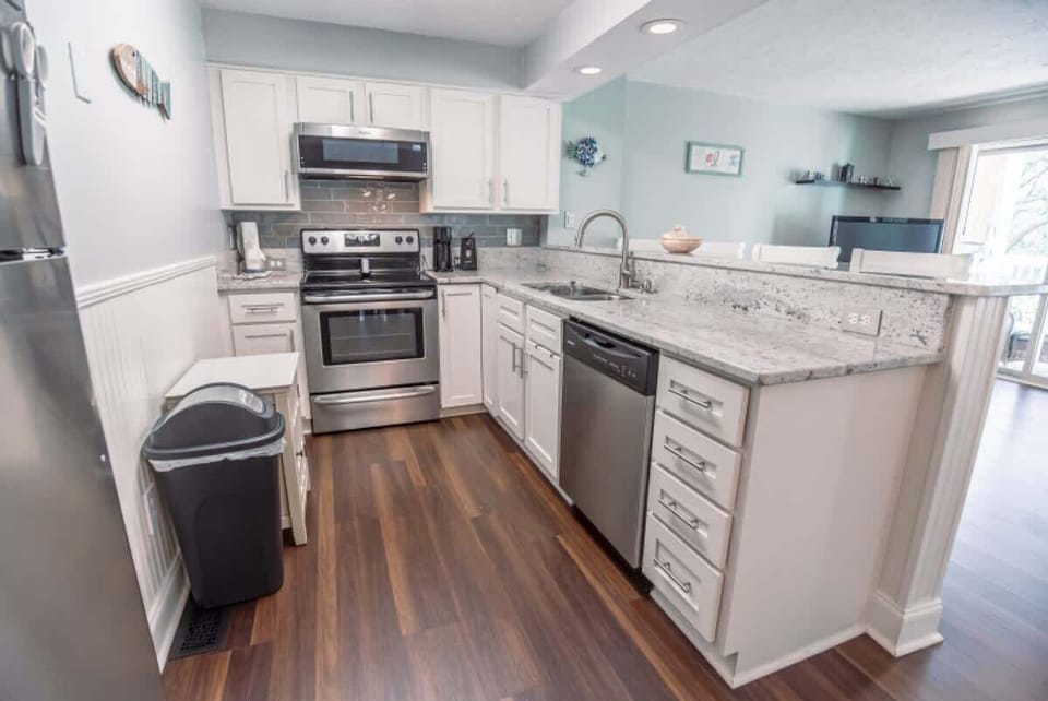 The sleek countertops and stainless steel appliances make this kitchen a chef's dream.