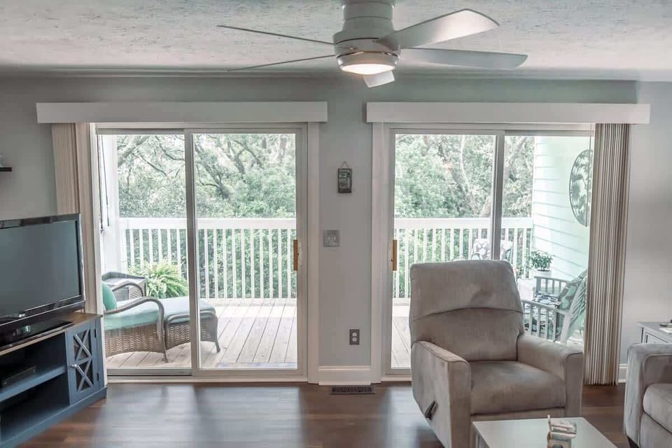 Relax and unwind as you take in the view, where indoor comfort meets outdoor serenity in this bright, breezy space.