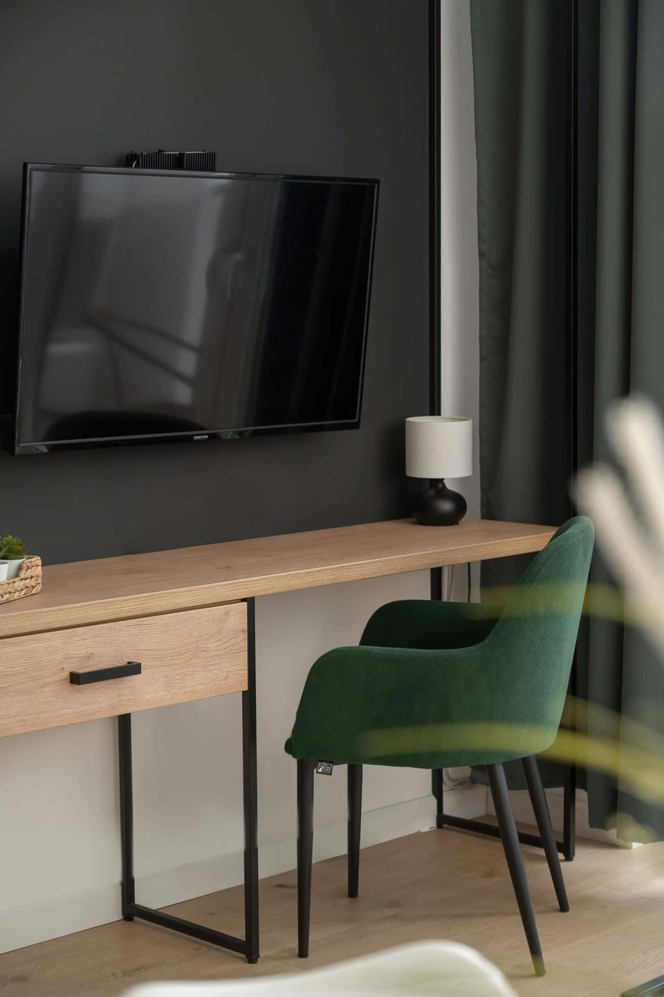 A close-up of the workspace, with a modern desk, chair, and stylish accessories for productivity.

