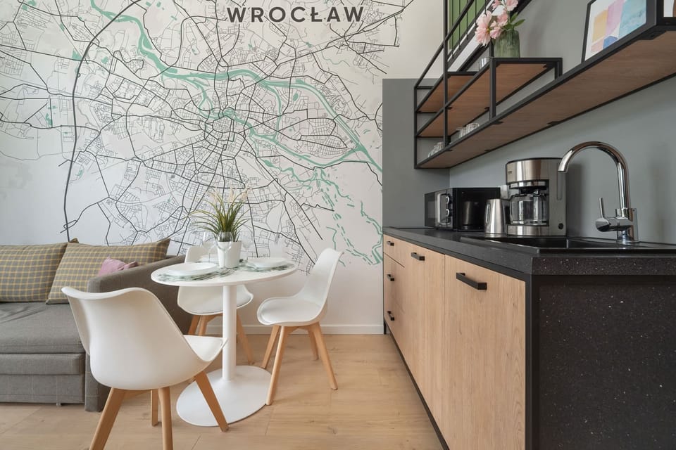 A well-equipped kitchen corner featuring a coffee machine, kettle, and toaster, providing all the essentials for guests.


