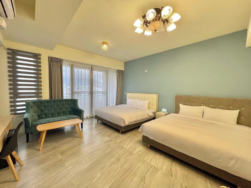 Deluxe Quadruple Room | Blackout drapes, soundproofing, iron/ironing board, free WiFi