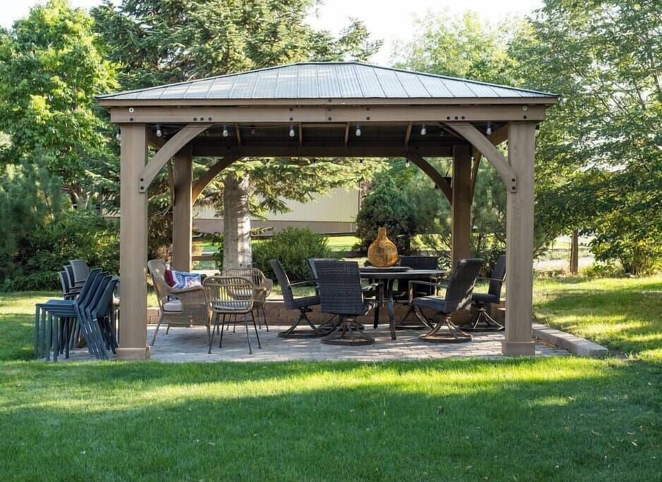 Ample backyard seating for dining in the backyard under the gazebo. 