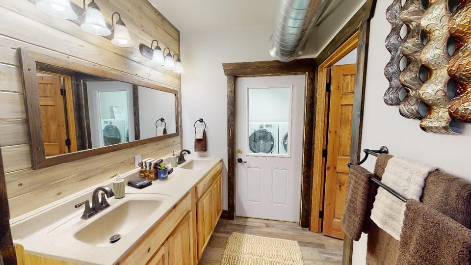 Full bath.   Dual vanity and separate shower and toilet area.   Also Laundry