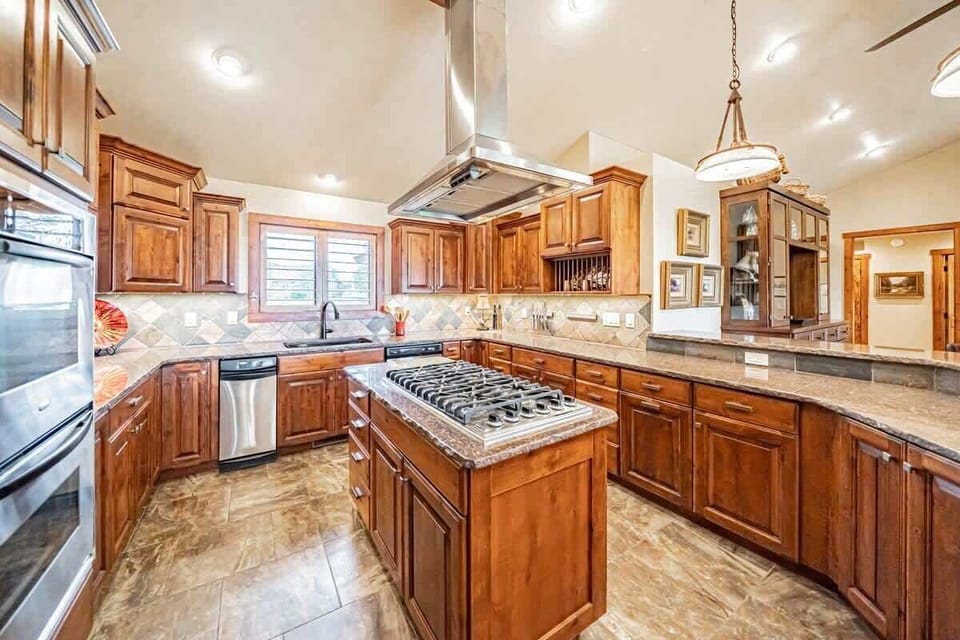 Large, well-stocked kitchen with quality appliances and plenty of space.